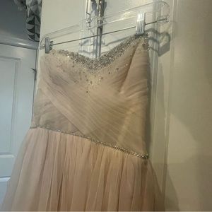 Brand new with tags, wedding dress, size 12. Gorgeous blush color with sparkle.